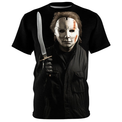 Front view of our black Halloween Hockey Mask 'Slay' all-over-print T-shirt! Chilling graphic showcases a man in all black, his identity concealed behind the iconic hockey mask, and a gleaming long-bladed knife gripped firmly in hand. Must have for horror lovers and anyone who wants a trendy Halloween tee.