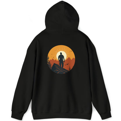 Black hoodie full back graphic that shows a mountain climber in silhouette staring at a mountain range at sunrise that's covered in an orange haze from the sun.