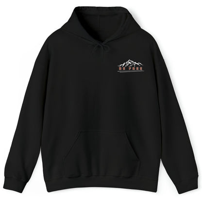 Black hoodie with a front logo that shows the top of a mountain range with the words "Be Free" underneath as a reminder to embrace your uniqueness.