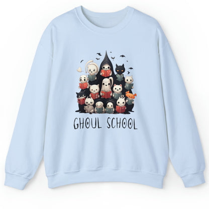 Light blue Halloween 'Ghoul School' ghost sweatshirt. The graphic showcases a group of cute, stylish ghosts reading books, which creates a spooky classroom scene. The words 'Ghoul School' in a spooky font complete the look. Perfect for teachers, librarians, educators, students, and ghost lovers.