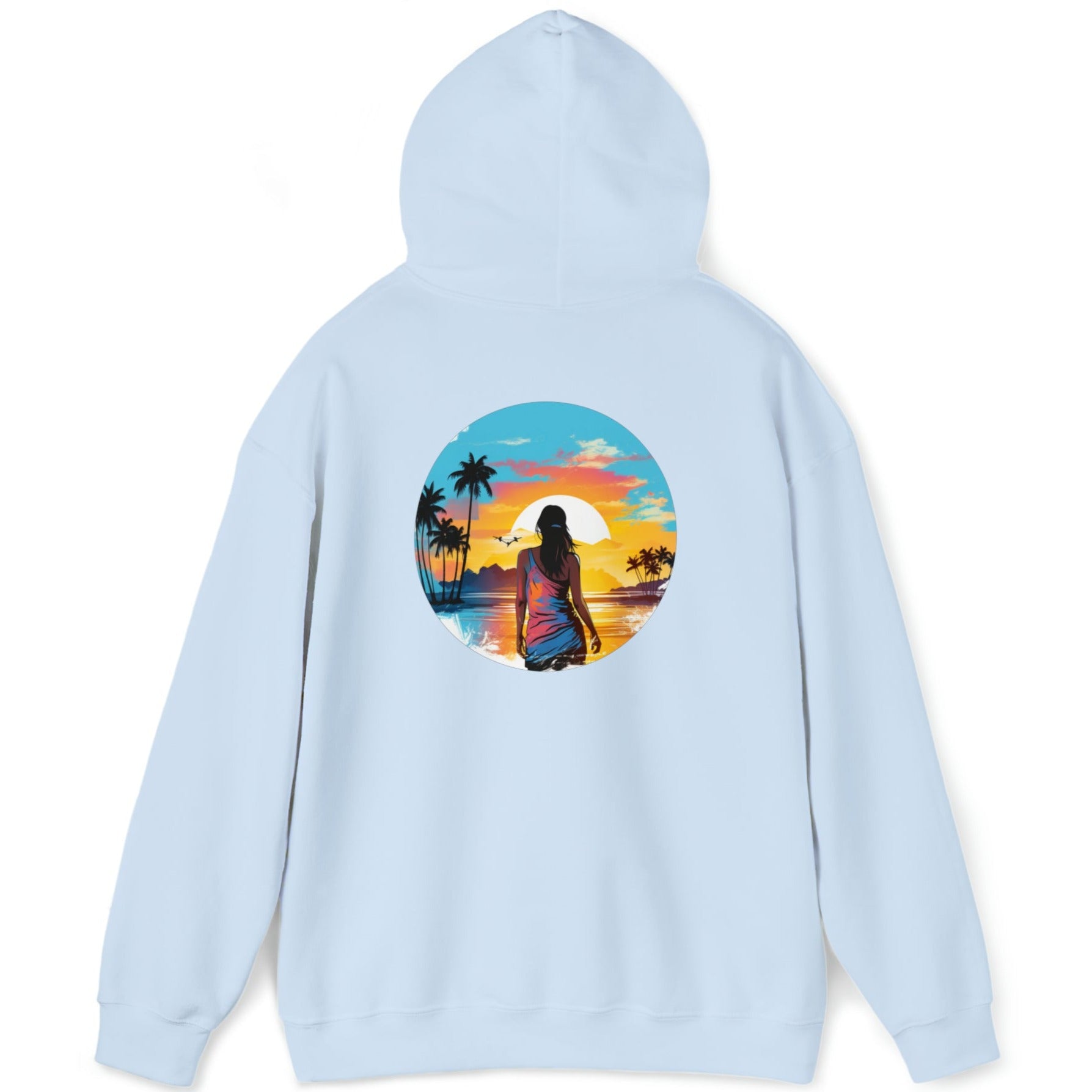 Back view of our light blue 'Be Free' Beach Sunset Hoodie showing a graphic of a woman gazing out over a tranquil sunset at the water's edge. In the distance, palm trees and majestic mountains create a breathtaking backdrop. Perfect casual wear for a cool day on the beach, hiking, or everyday activities.