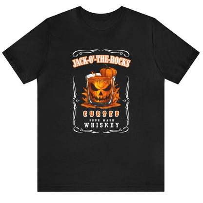 Black Halloween Jack Whiskey Label Tshirt with Jack-o-the-Rocks title over a jack-o-lantern submerged in a lowball glass with filled with whiskey. The bottom of the label reads "Cursed Sour Mash Whiskey."