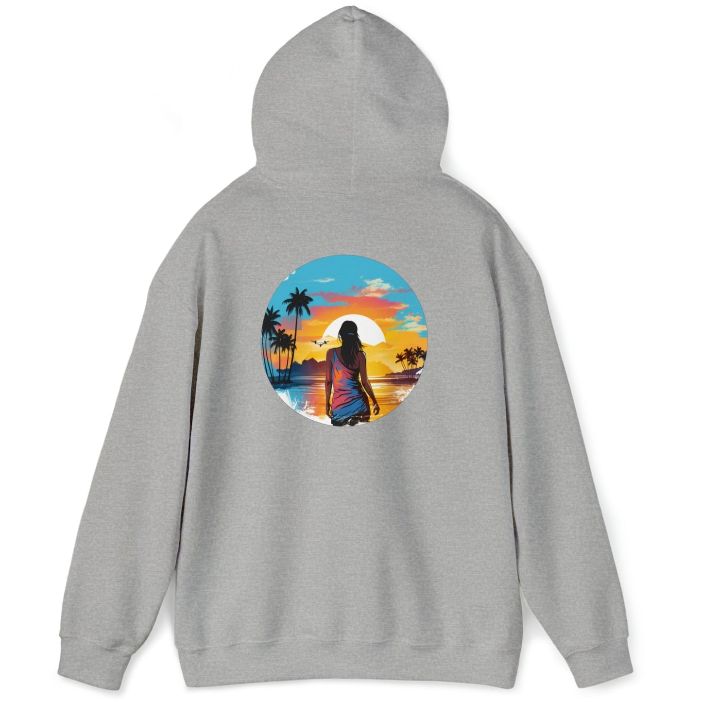 Back view of our grey 'Be Free' Beach Sunset Hoodie showing a graphic of a woman gazing out over a tranquil sunset at the water's edge. In the distance, palm trees and majestic mountains create a breathtaking backdrop. Perfect casual wear for a cool day on the beach, hiking, or everyday activities.