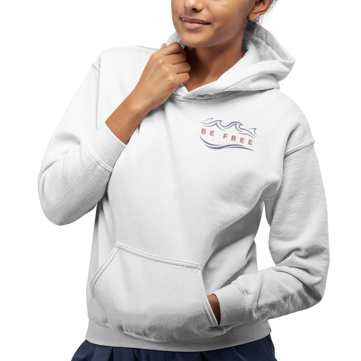 Front view of a young woman wearing a white Hoodie featuring the 'Be Free' logo on the upper right. Perfect casual wear for a cool beach morning, hiking, relaxing, or everyday activities. 