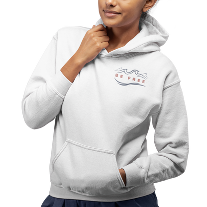 Front view of a young woman wearing a white Hoodie featuring the 'Be Free' logo on the upper right. Perfect casual wear for a cool beach morning, hiking, relaxing, or everyday activities. 