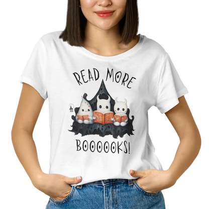 Woman wearing white graphic tee showing three ghosts reading books in a spooky scene. Perfect for teachers, librarians, school staff, students, or anyone looking for classroom fun.