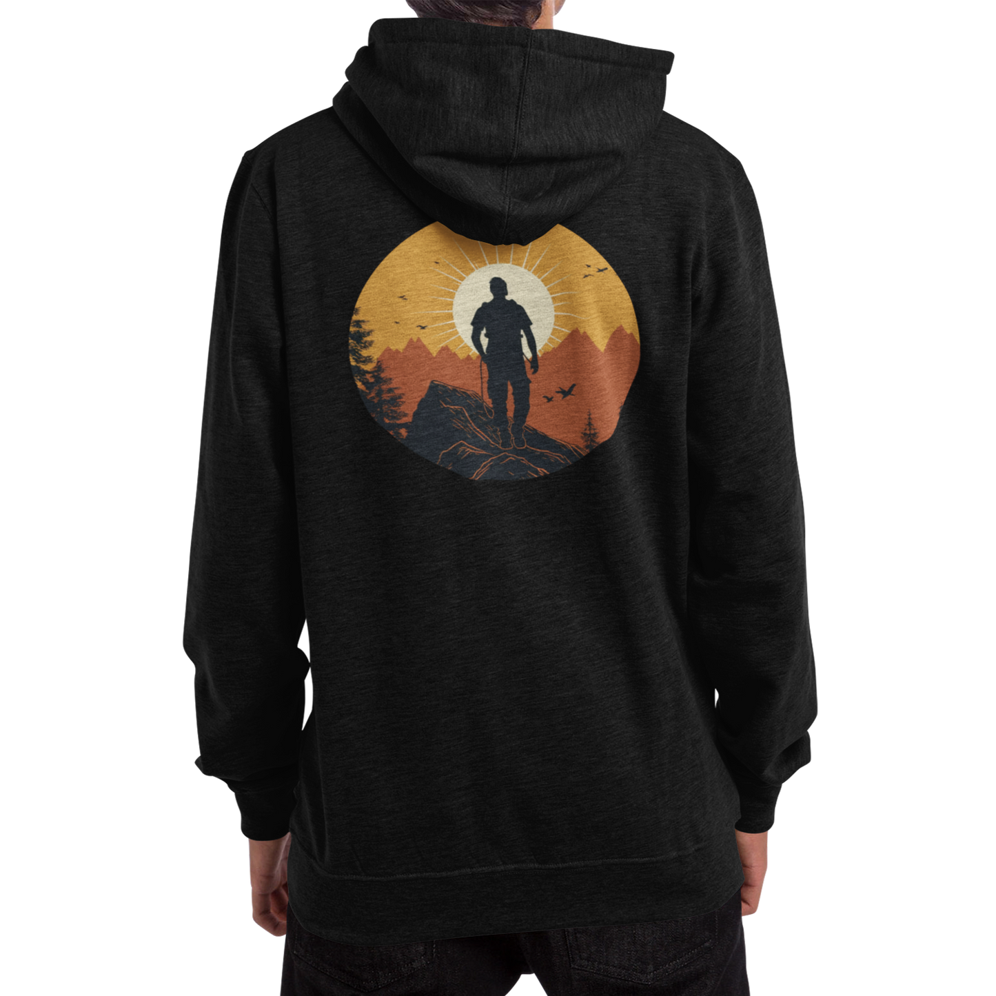 Man wearing a black hoodie with a full back graphic that shows a mountain climber in silhouette staring at a mountain range at sunrise that's covered in an orange haze from the sun.