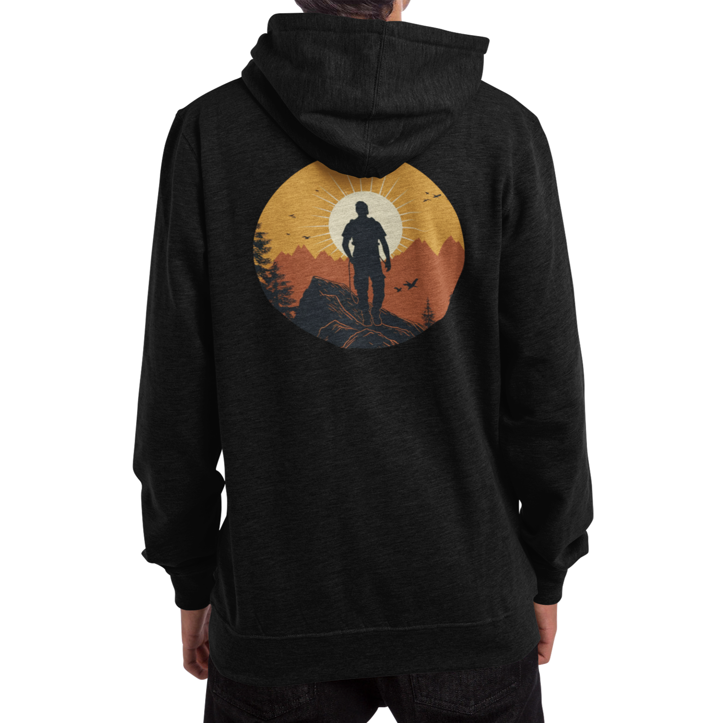 Man wearing a black hoodie with a full back graphic that shows a mountain climber in silhouette staring at a mountain range at sunrise that's covered in an orange haze from the sun.