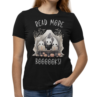 Woman wearing a black Halloween "Read More Boooooks!" tee with a trio of ghosts engrossed in books. Perfect for teachers, librarians, school staff, students, or anyone looking for classroom fun.